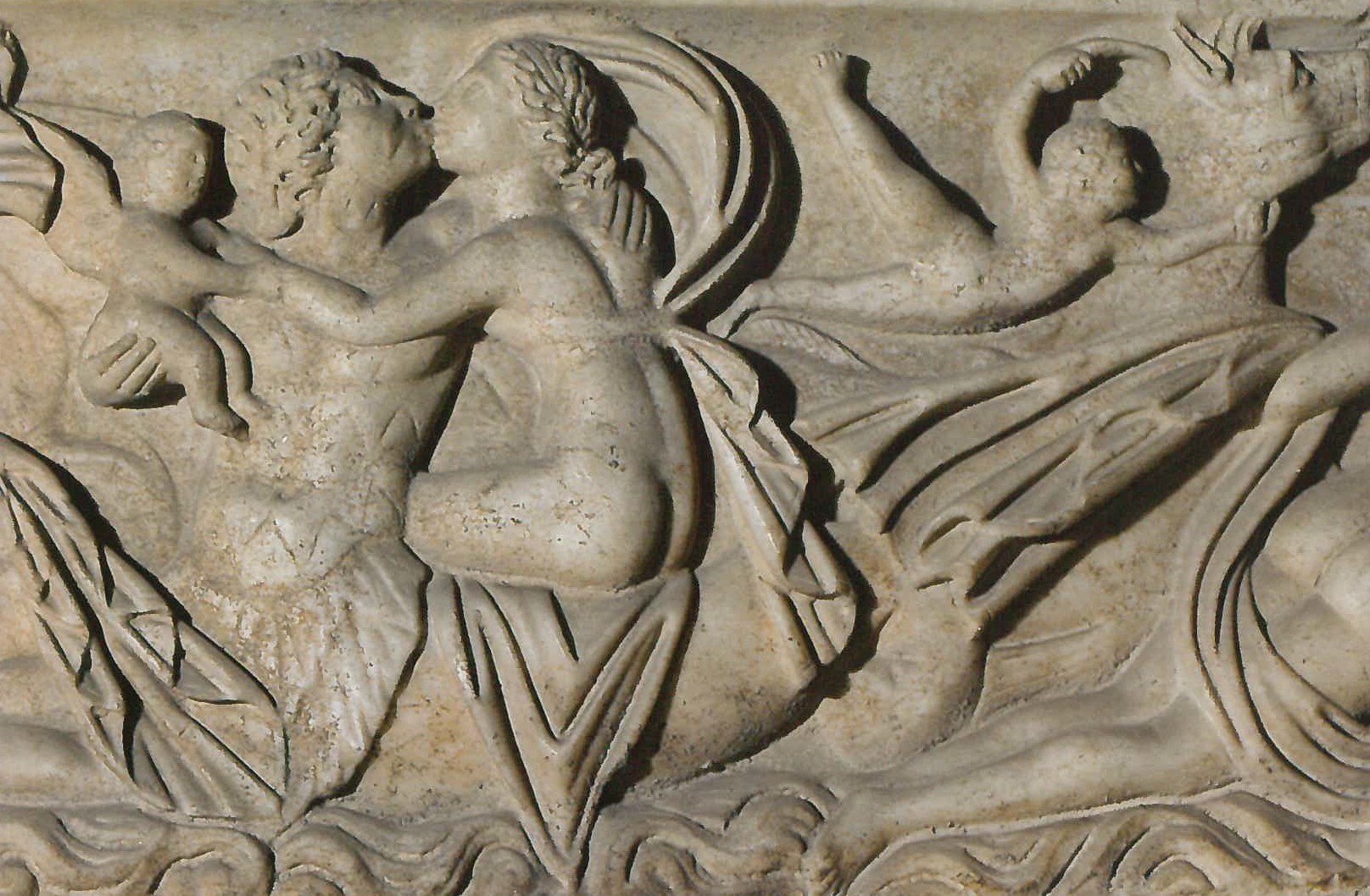 Triton holding child and kissing Nereid