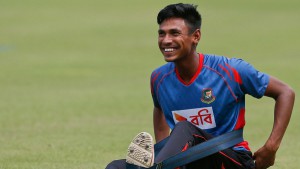 Mustafizur Rahman stretches during practice ahead of the second Test in Dhaka beginning on July 30 © Associated Press