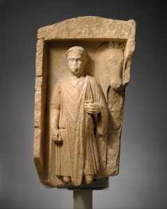 Limestone funerary monument of a beardless man