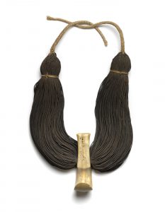 Whale tooth necklace (lei niho palaoa), early 19th century, human hair and walrus ivory, Mount Holyoke College Art Museum, MH 7.V.M