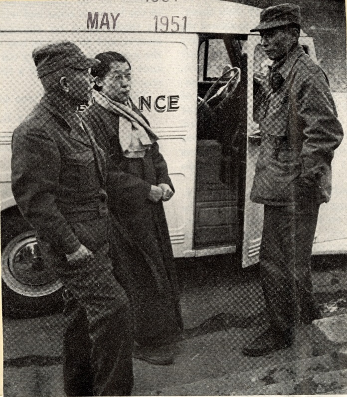 Dr. K.S Sobn holds door to ambulance for Sungsil Kim Ough (Mount Holyoke class of 29) and Young Choon Rhee, Secretary General, outside of the temporary office of the Korean National Red Cross in Pusan.
