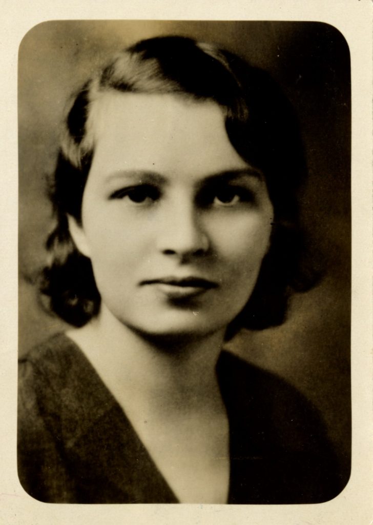 Esther Ward, shown in a waist-up shot, wears a black top with hair cut short.