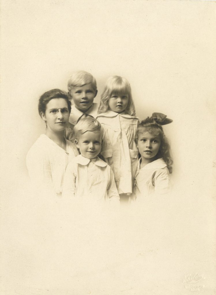 Family photo of Esther Ward when she was a child, Esther Ward is the fifth from the left in the photo, 1918, Charlotte Edwards Ellen Ward Papers.