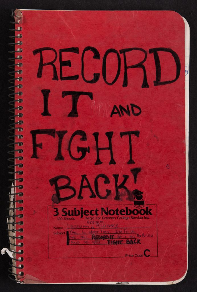 Red notebook cover with black handwritten text