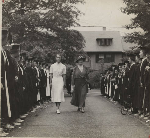Mary Woolley being escorted by Sarah Cole '37 through members of the Class of 1937 during the Centennial Celebration