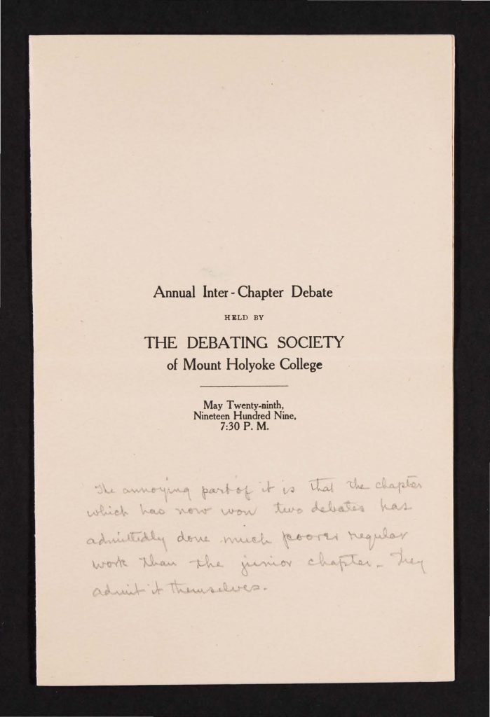 Black typewritten text as well as handwritten notes in black ink on browning paper